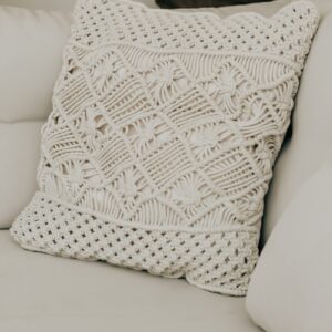 a white pillow on a couch