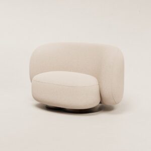 a white couch sitting on top of a white floor