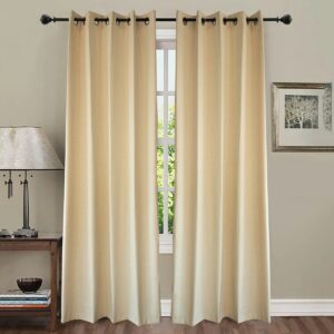 Cream colored curtains hang over a window