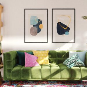 green and white throw pillows on green sofa