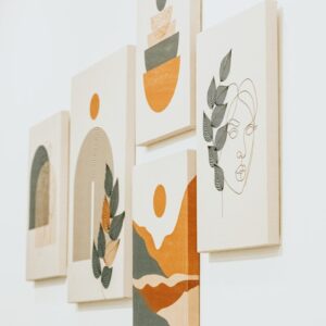 a group of paintings hanging on a wall