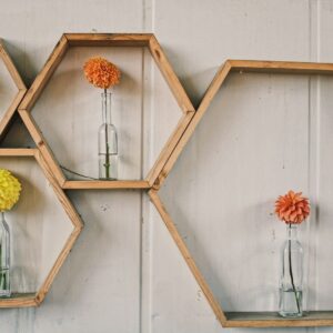 orange and yellow flowers on white wooden wall